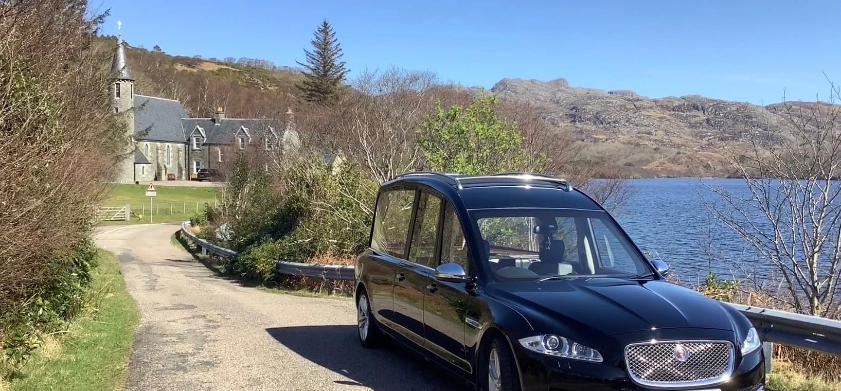 McLellan Funeral Directors - Hearse Image Next to Country Estate